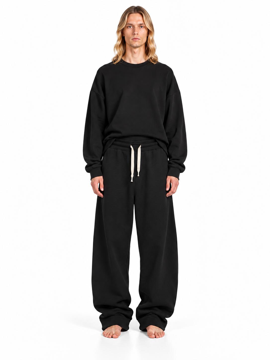 Pantalone Yoshi AGM nero con coulisse chiara a contrasto, indossato frontalmente